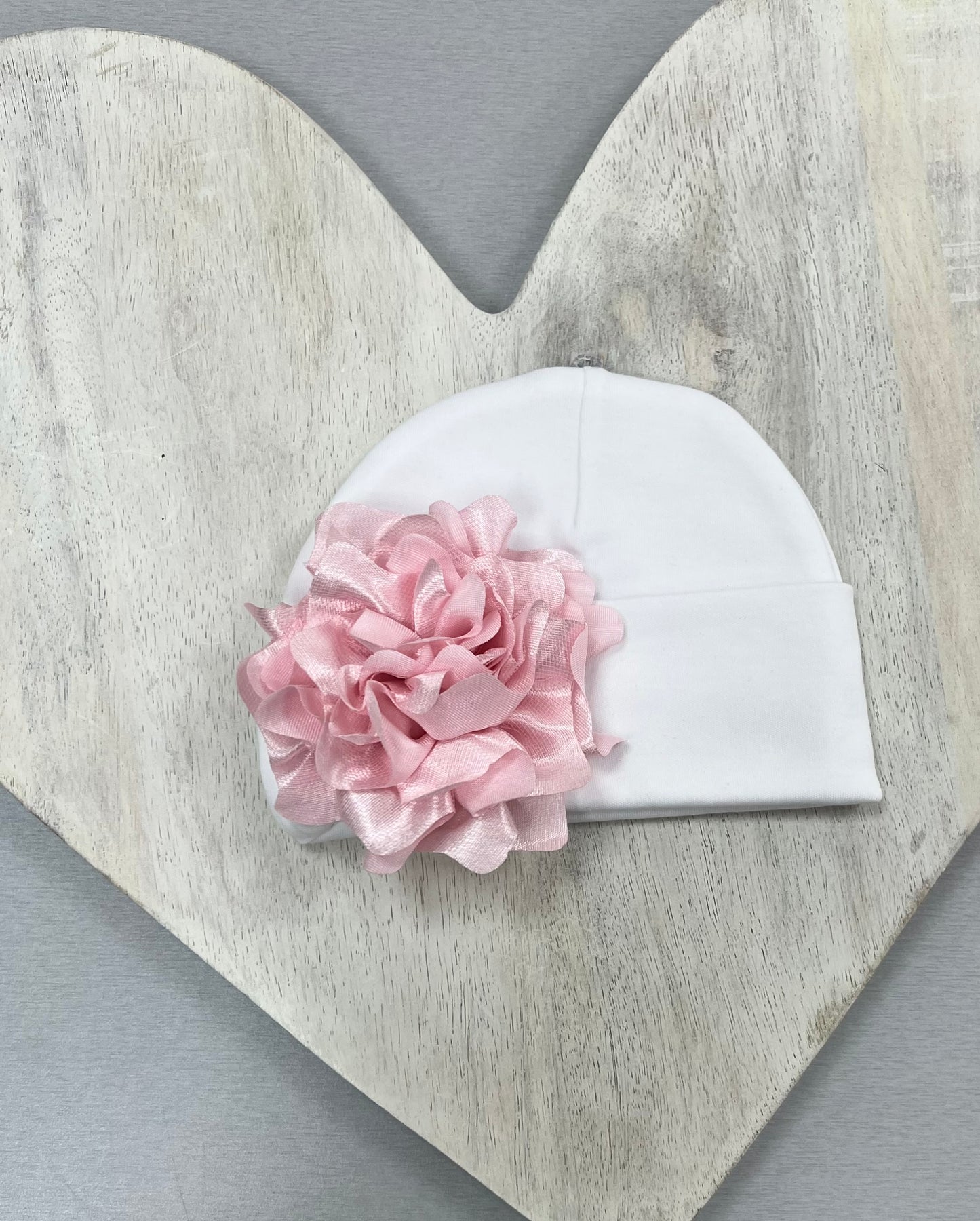 Pink and white Baby Hats with floral or bow accents