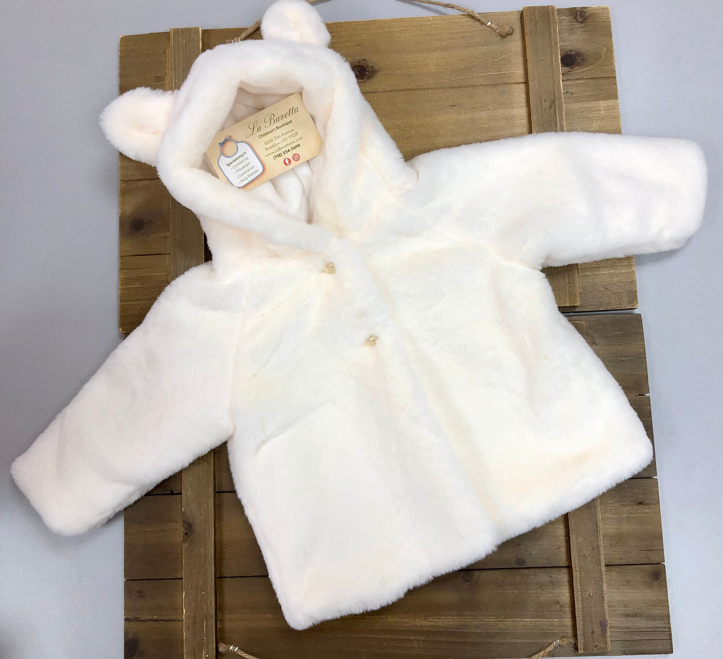 Baby’s white plush faux fur jacket