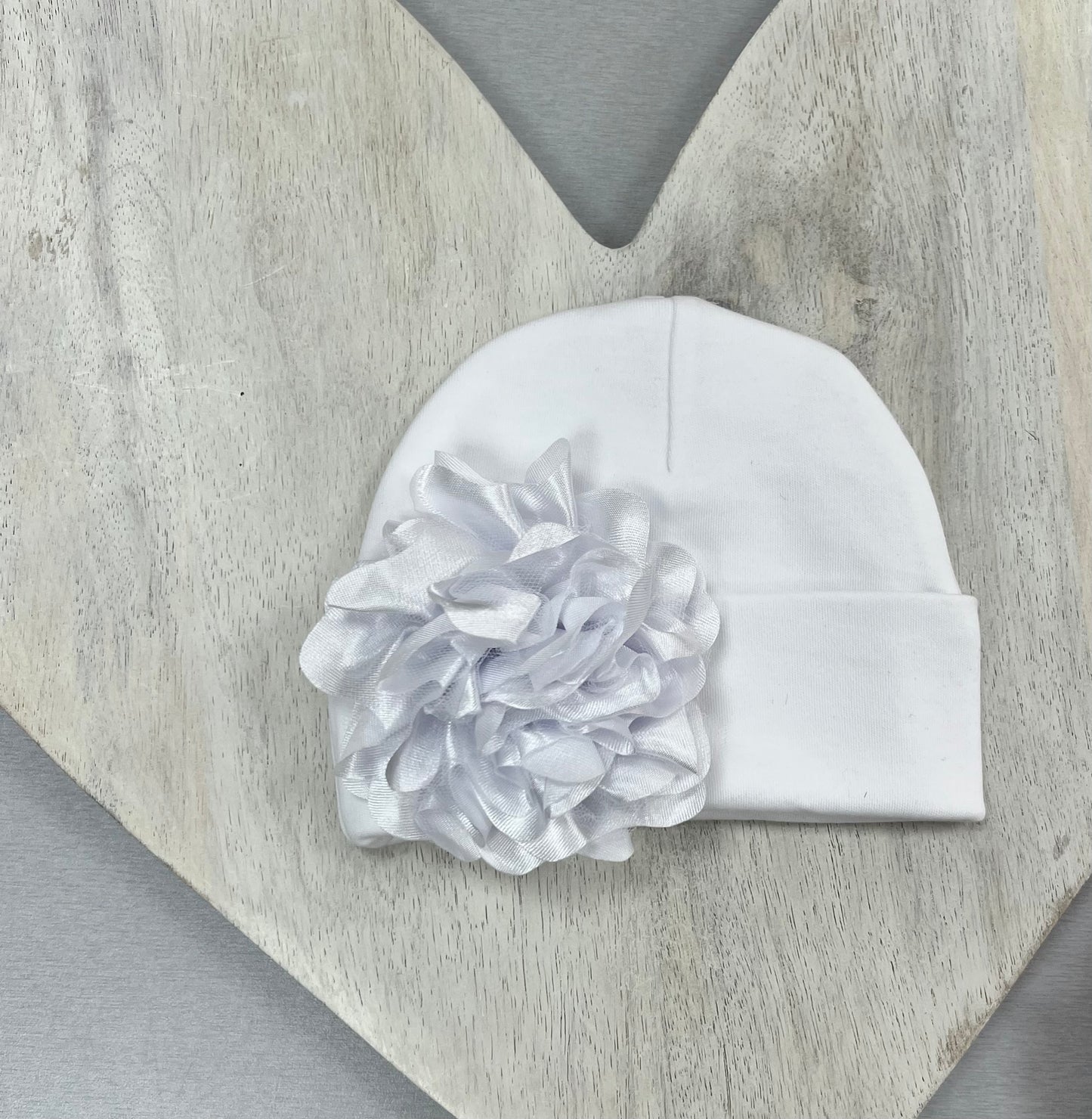 Pink and white Baby Hats with floral or bow accents