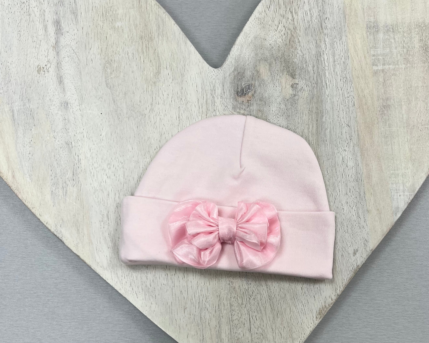 Pink and white Baby Hats with floral or bow accents