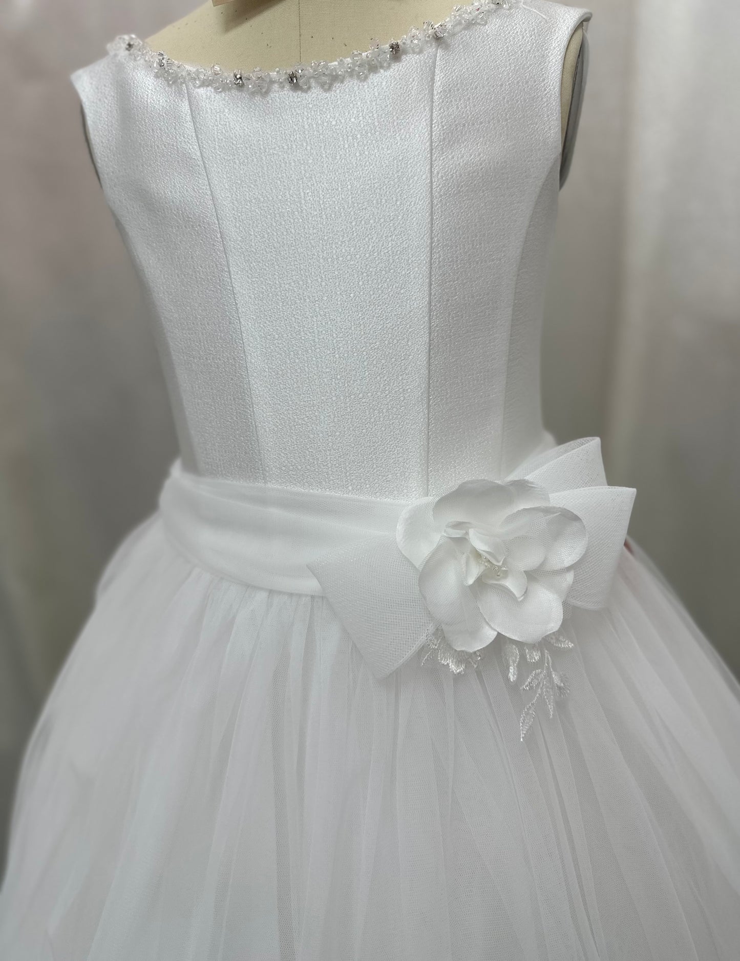 Detailed Michelina Bimbi communion dress with embroidered skirt and floral belt