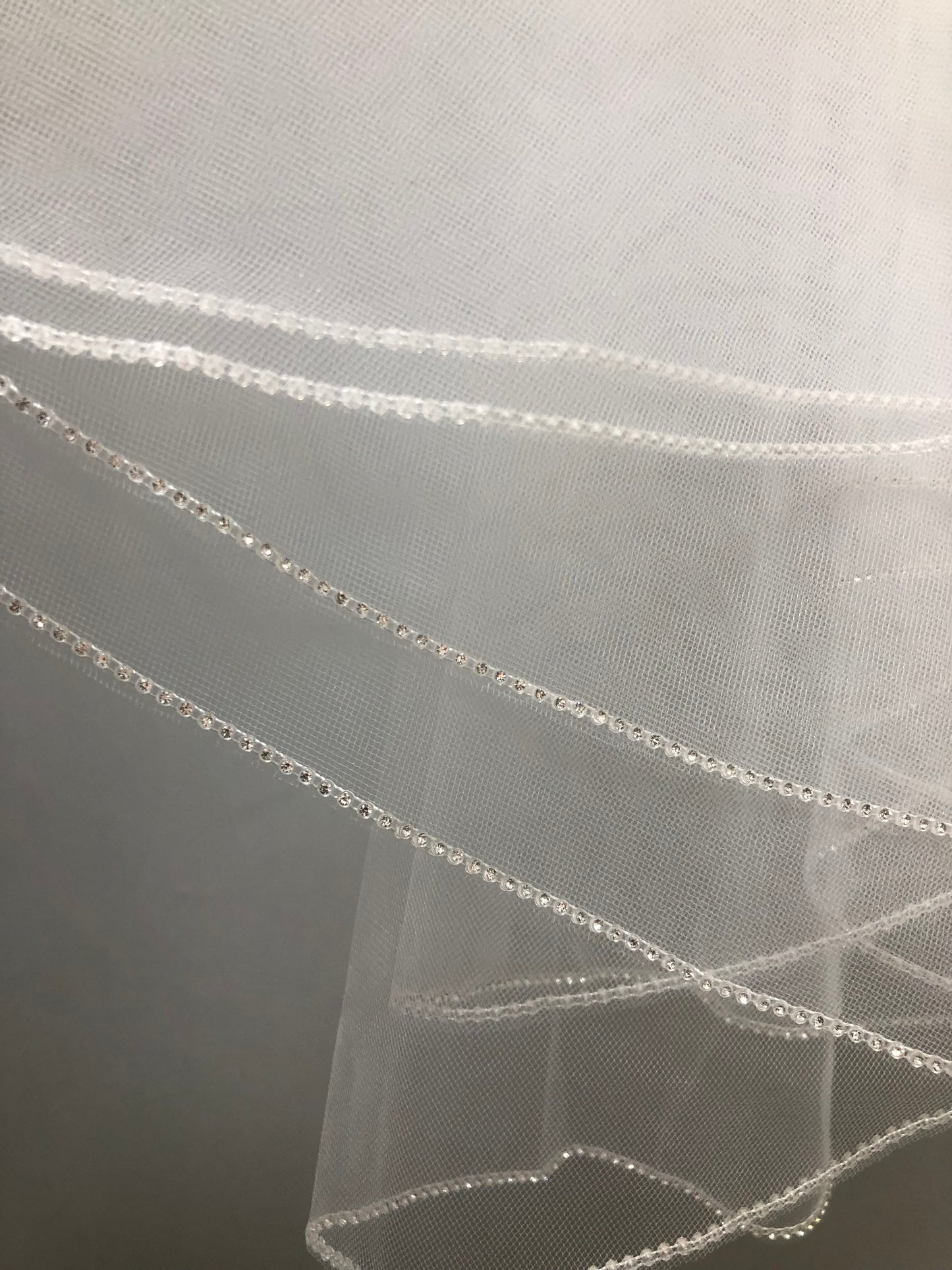 White communion veil with rhinestone edge