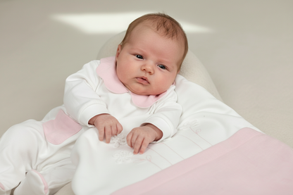 1-month-old baby wearing pink and white take home set