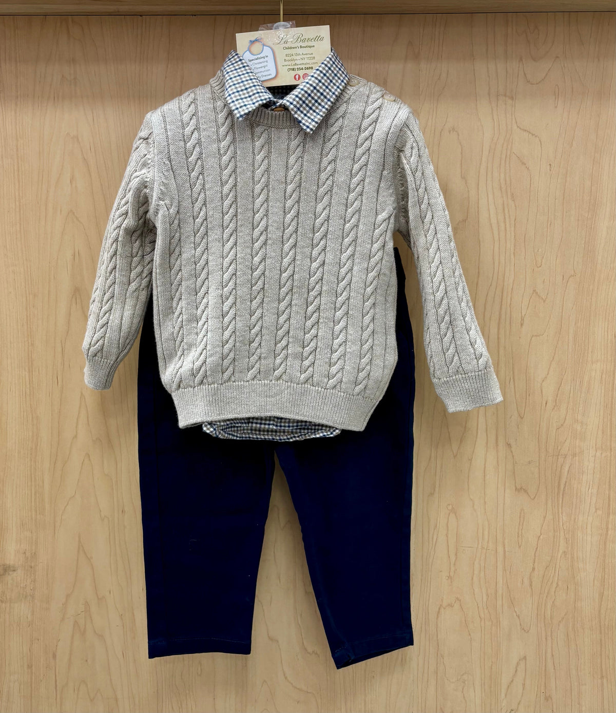 Boys cable-knit sweater over gingham shirt with navy pants outfit