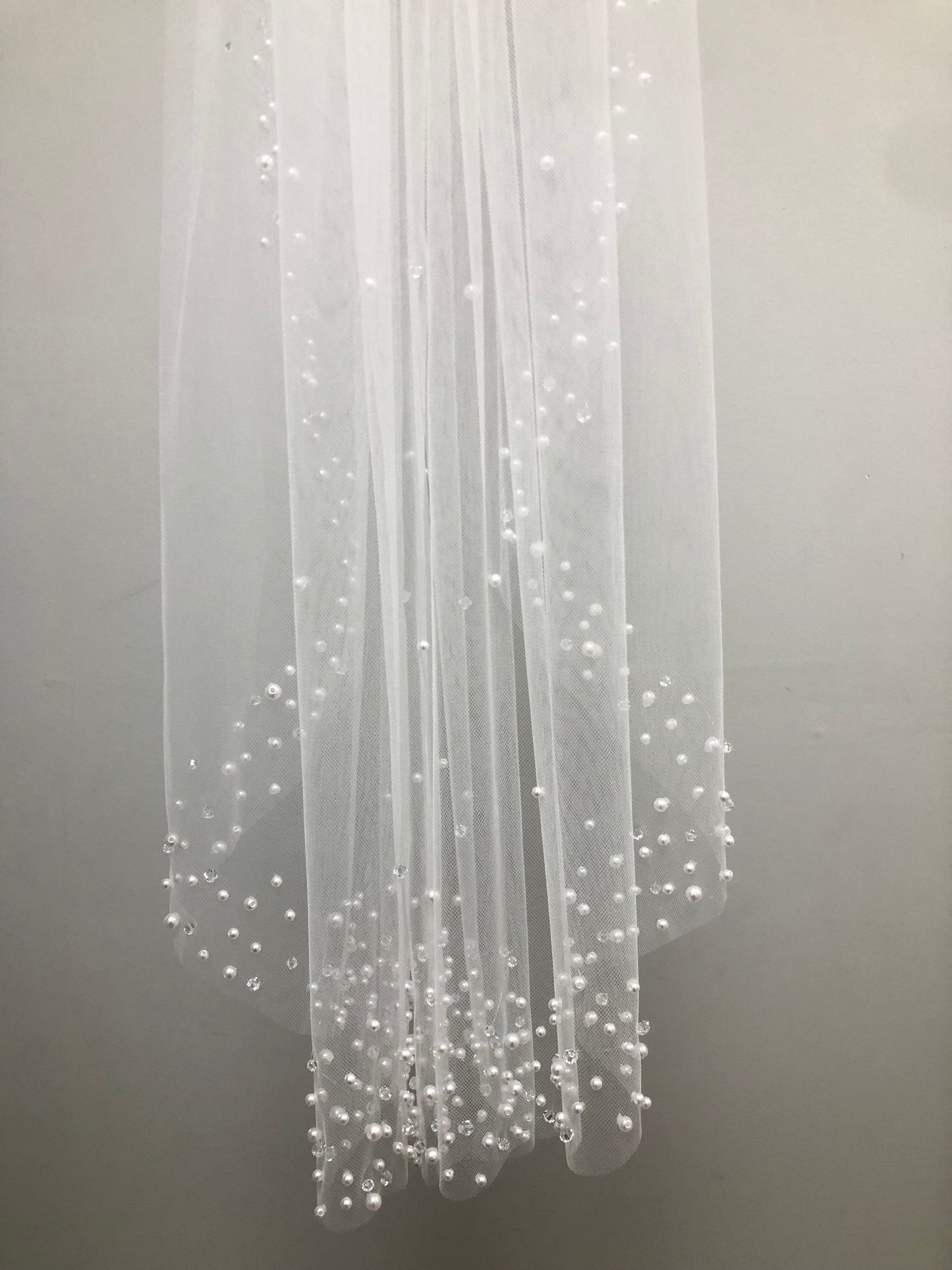White communion veil with scattered pearl edge