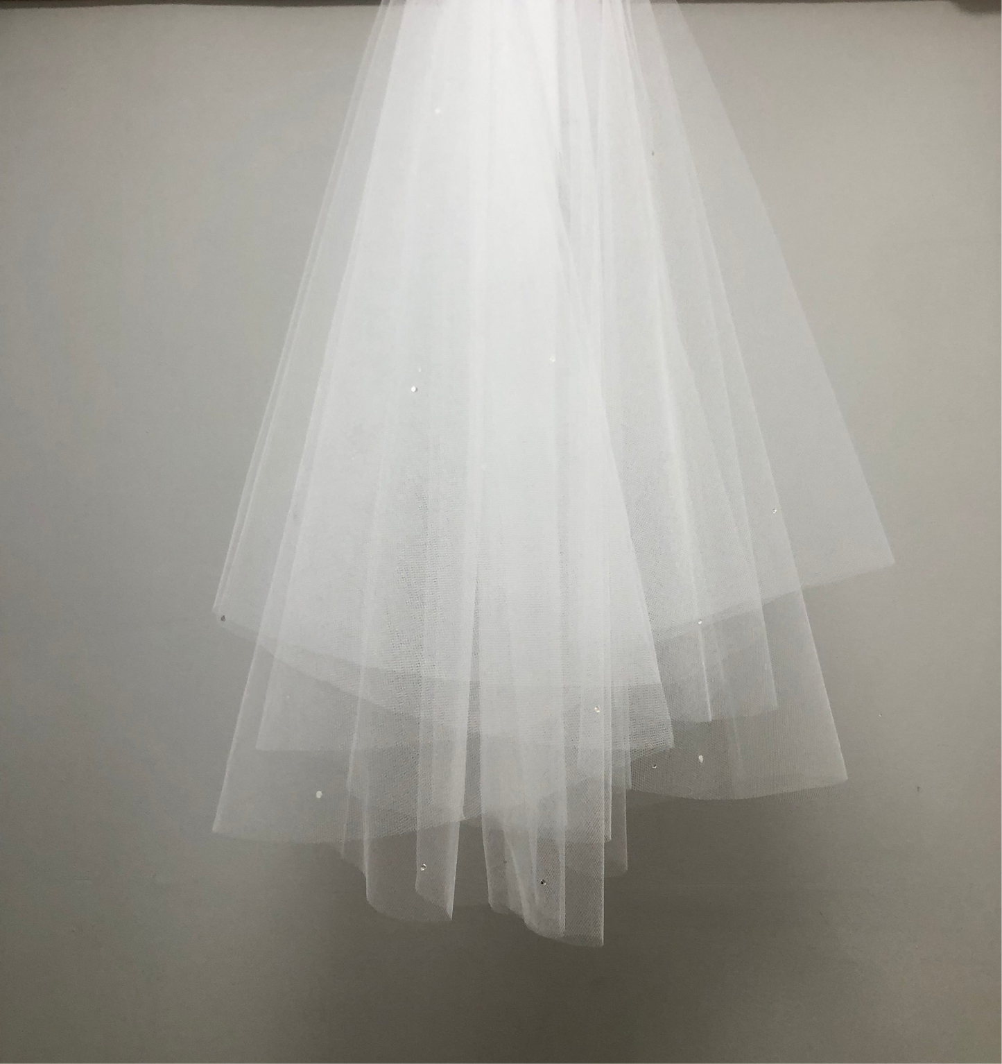 White communion veil with scattered pearls