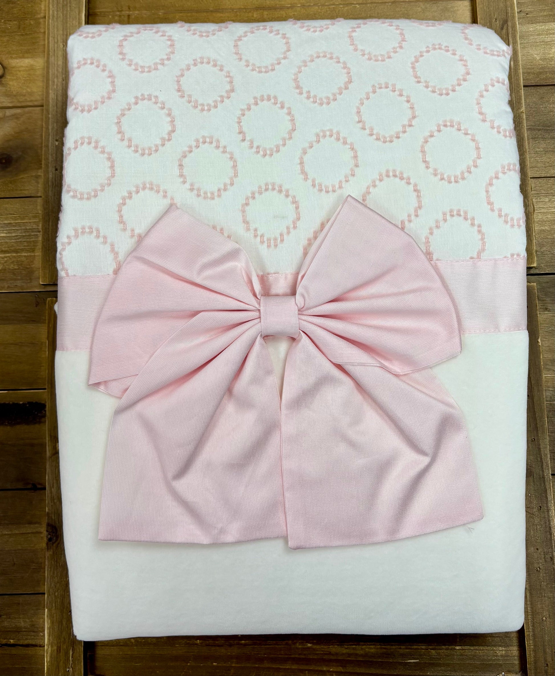 Complete 3-piece ivory and pink baby girl take-home set with sleeper, hat, and blanket