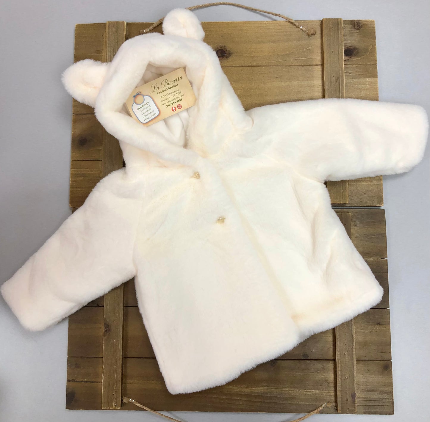 Baby’s white plush faux fur jacket