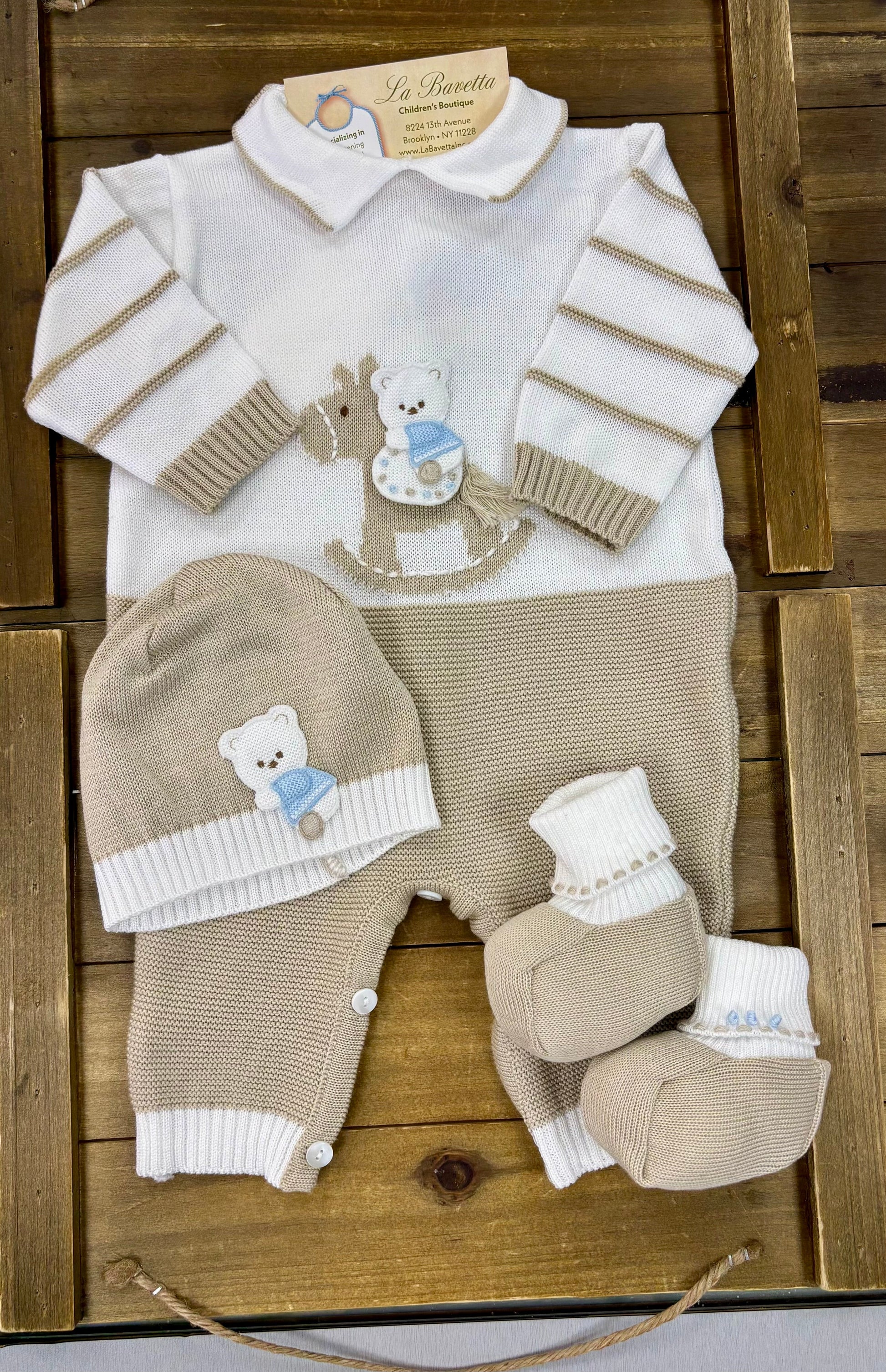 4-piece baby knit layette set in beige and white with rocking horse and teddy bear appliqué, including romper, beanie, booties, and blanket