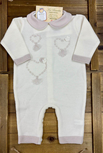 Ivory knit baby romper with embroidered lamb motifs and blush pink trim