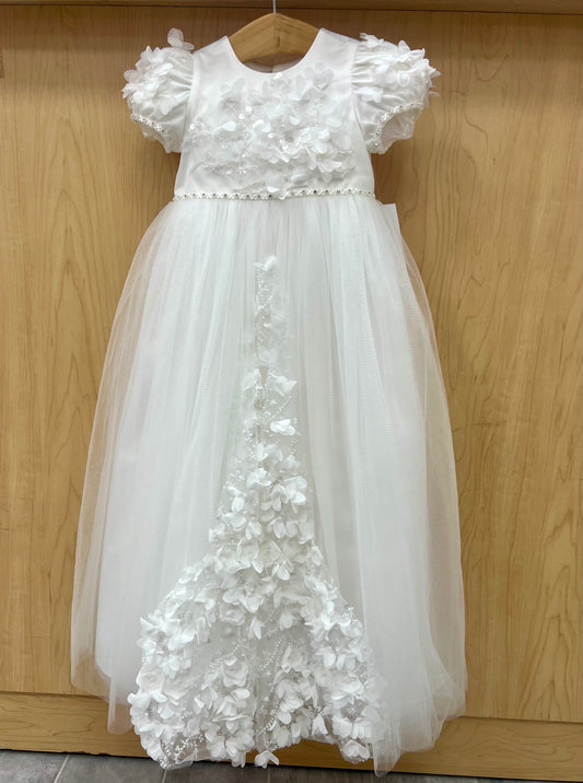 An off white christening dress with 3D floral details and cap sleeves