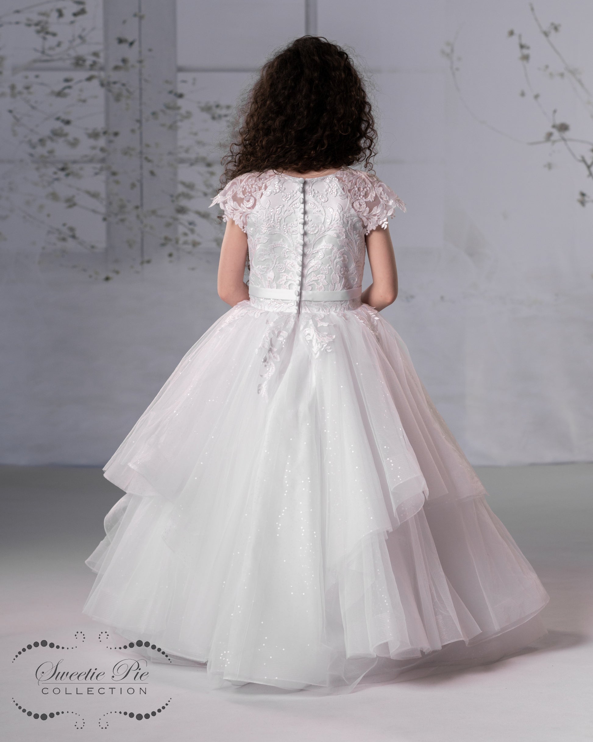 Back Sweetie Pie Communion Dress full skirt and center bow