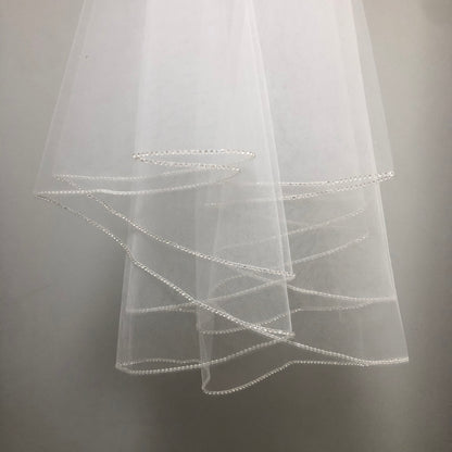 White communion veil with rhinestone edge