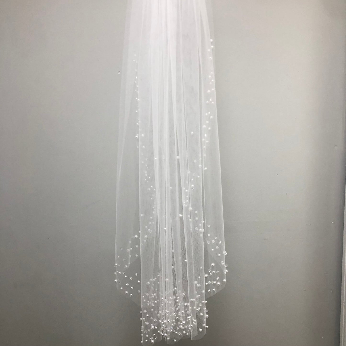 White communion veil with scattered pearl edge