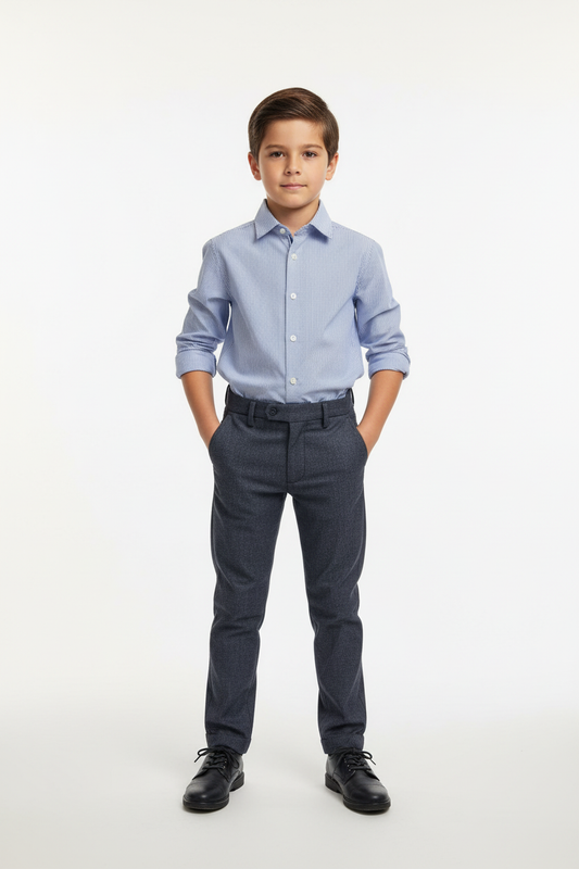 Boy wearing striped shirt and dark pants