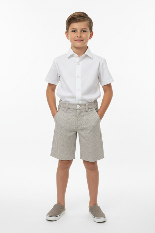 Boy wearing white shirt and checkered shorts