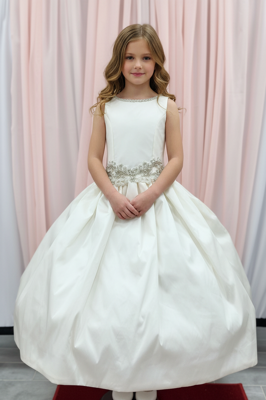 Girl wearing communion gown - front view without veil