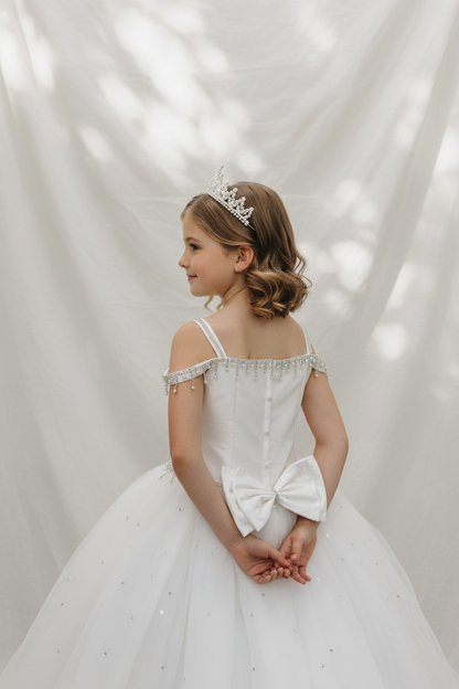 Girl wearing Margo communion dress - back view with hands at sides